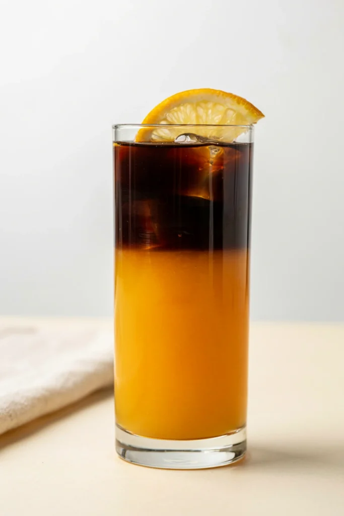 Two-toned orange and black Werewolf Howler with a fang-cut orange garnish