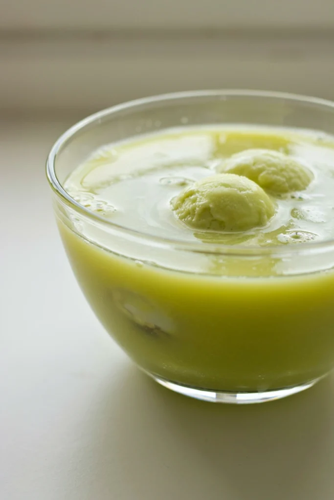 Frosty green Zombie Brain Punch with clumps of lime sherbet floating on top